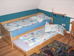 Ferienhaus Obergeschoss Schlafzimmer Einzelbett